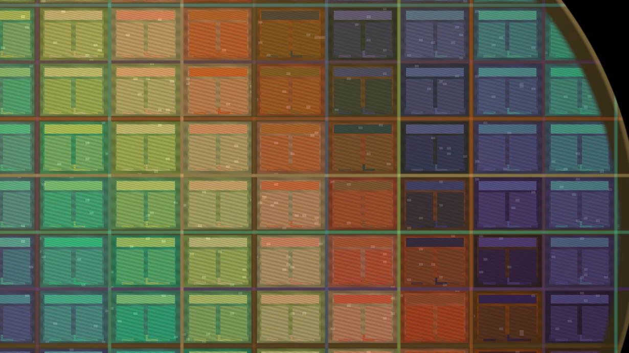 Macro view of dies on a lit silicon wafer